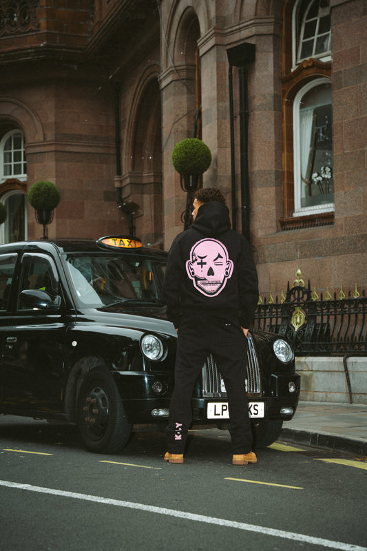 YAK BLACK TRACKSUIT WITH PINK BIG HEAD LOGO DETAILS