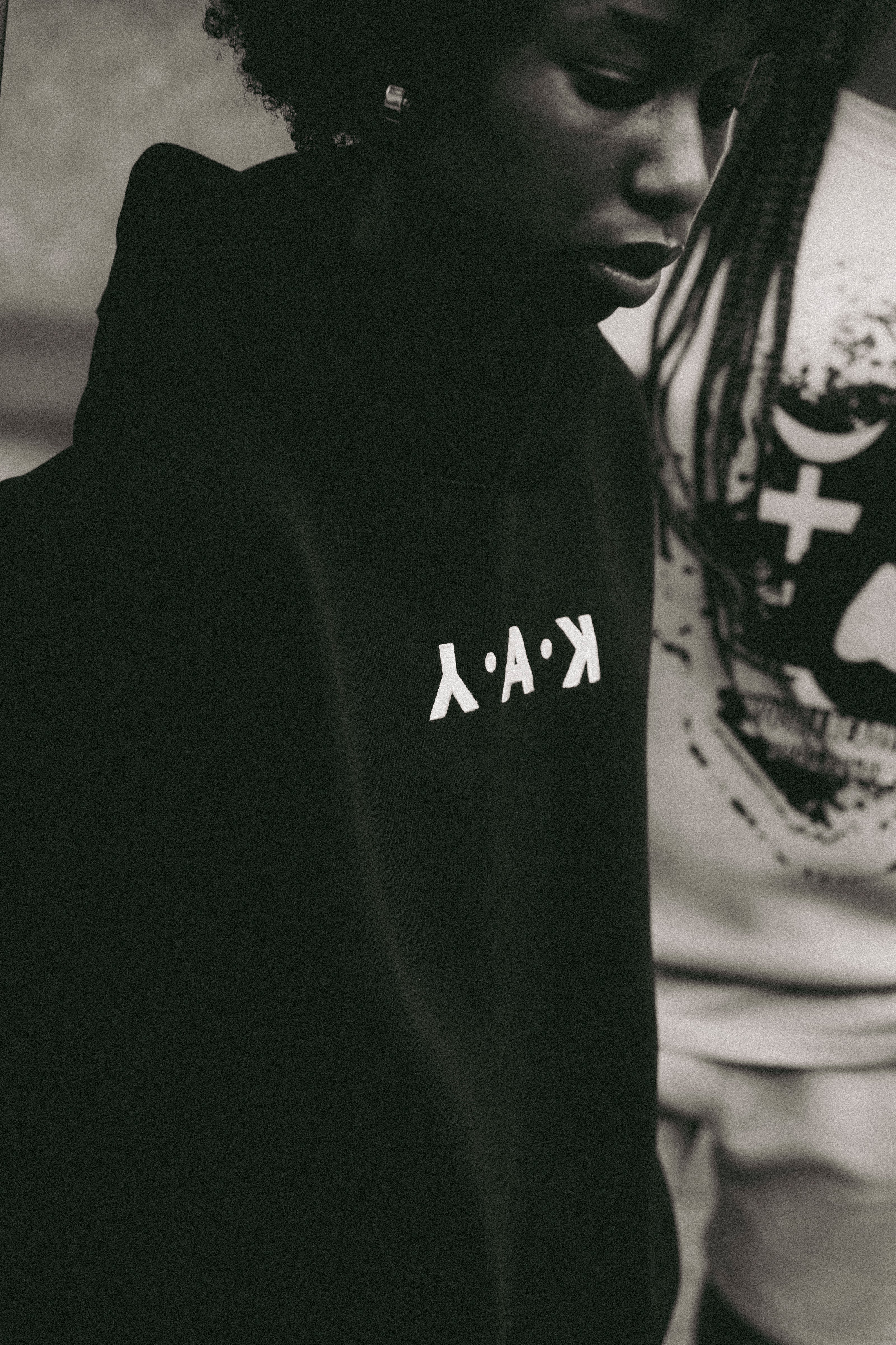 black and white y.a.k hoodie with bold logo