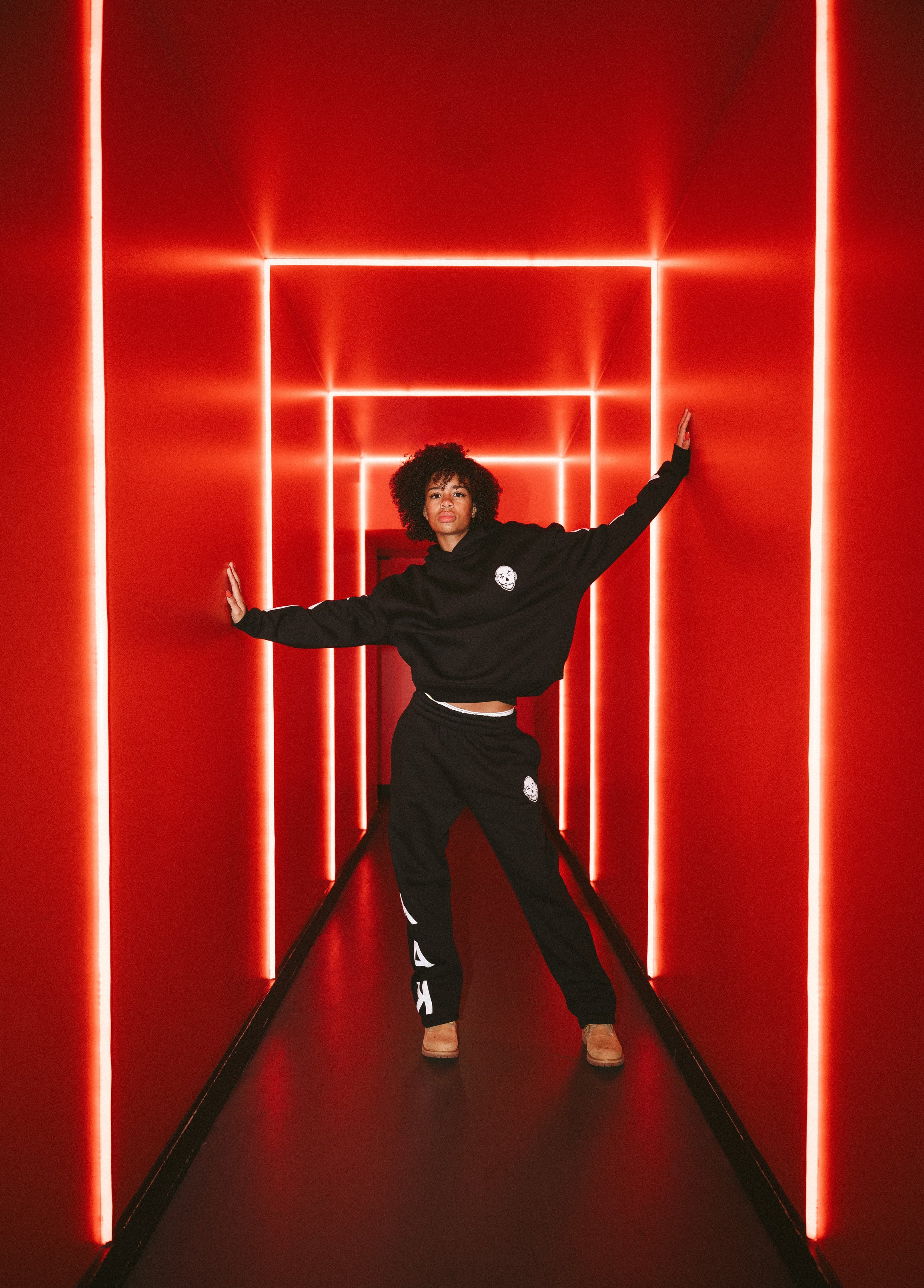 y.a.k black tracksuit with white puff print details.