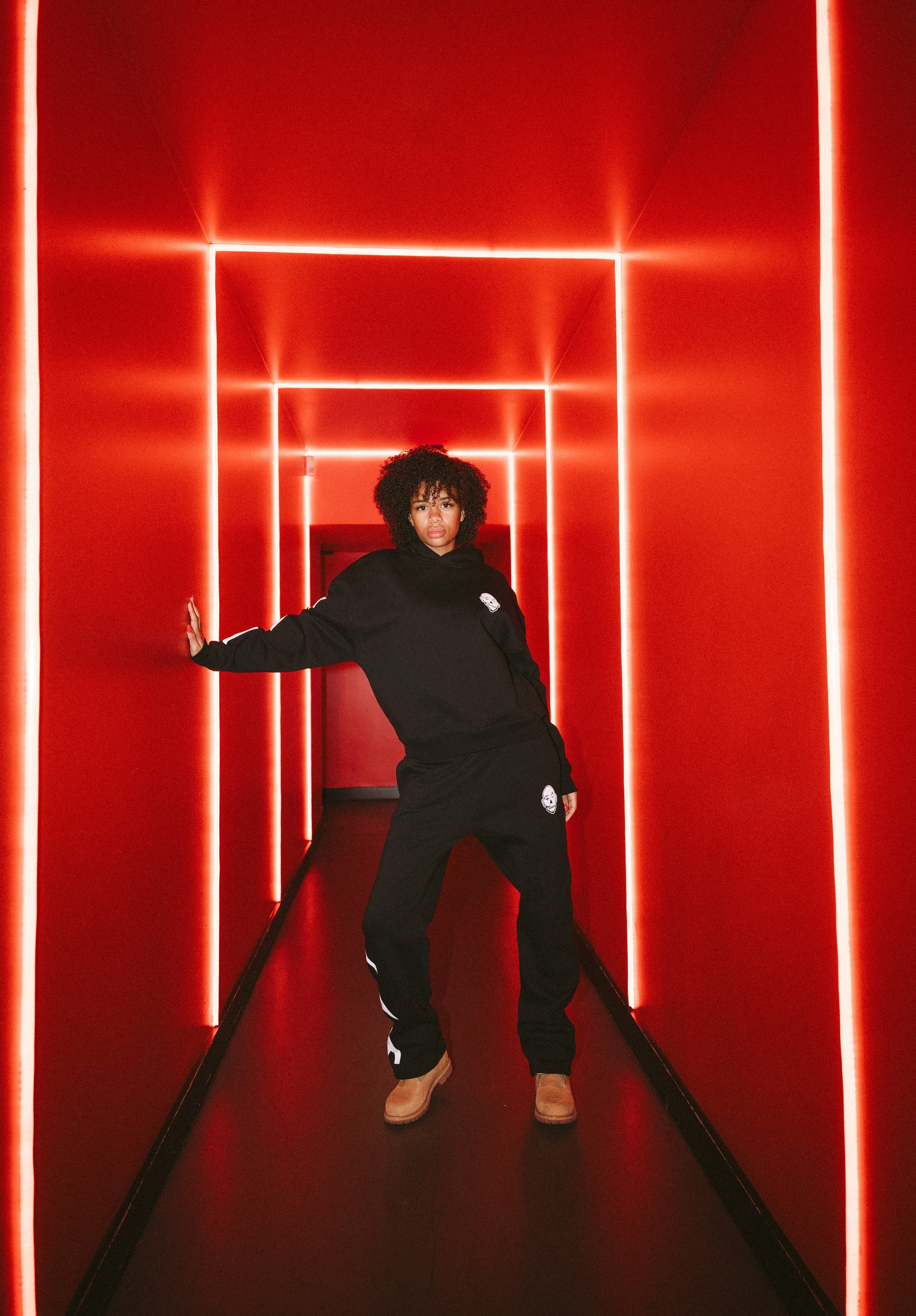 y.a.k black tracksuit with white puff print details.