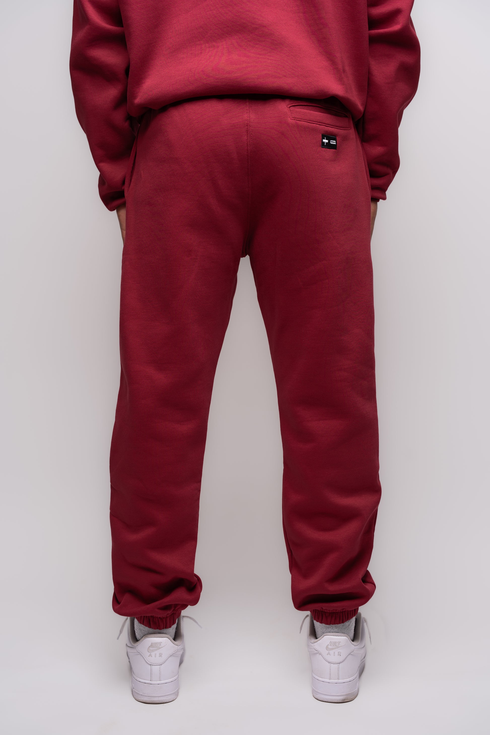 yak burgundy jogger with embroidery details on the back pocket